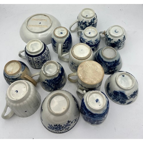 207 - A collection of 18thC blue and white cups, cans and saucers, both pottery and porcelain.