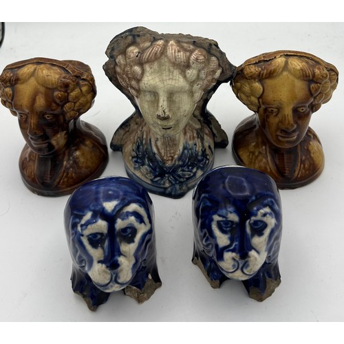 208 - Nineteenth century pottery furniture rests, two pairs and a single. Three modelled as female heads, ... 