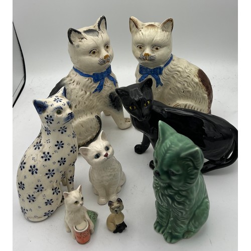 209 - Eight various 19th/20th C ceramic cats to include Royal Doulton and Sylvac. Tallest 20cm h.