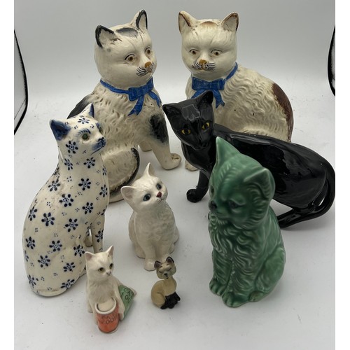 209 - Eight various 19th/20th C ceramic cats to include Royal Doulton and Sylvac. Tallest 20cm h.