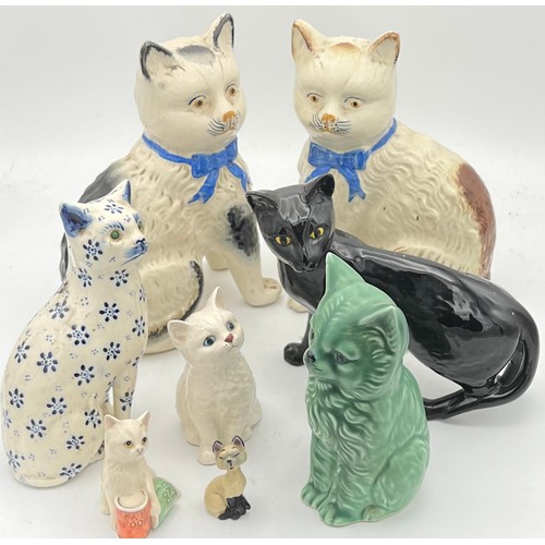 209 - Eight various 19th/20th C ceramic cats to include Royal Doulton and Sylvac. Tallest 20cm h.