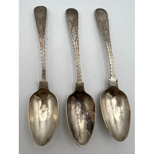 714 - Three Exeter silver teaspoons with bright cut decoration. Maker Richard Ferris 1797-8. Weight 33.9 g... 