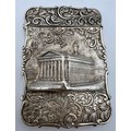 A Victorian silver castle-top card case. The Royal Exchange London in high relief with a foliage scr... 
