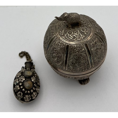 721 - Indian white metal lidded bowl 11cm h  together with a white metal snuff bottle.