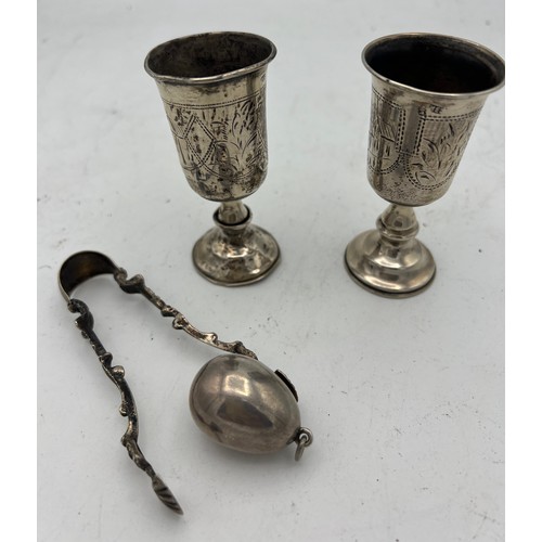 722 - Russian and continental silver to include two miniature goblets 8.5cm h, egg pendant with Virgin Mar... 