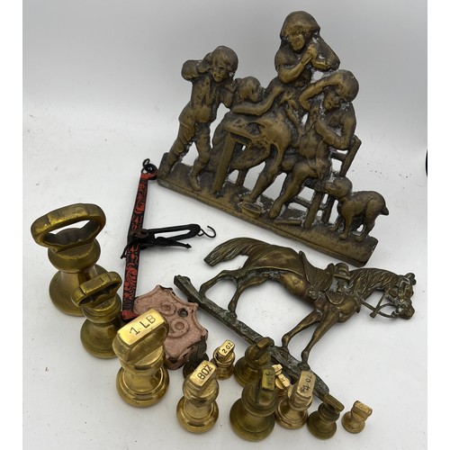 821 - Metalware to include brass bell weights, doorstops etc.