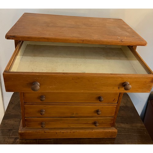 790 - A six drawer pine collectors cabinet with glass tops to drawers. 42 cm h x 22cm d x 38cm w. Label to... 