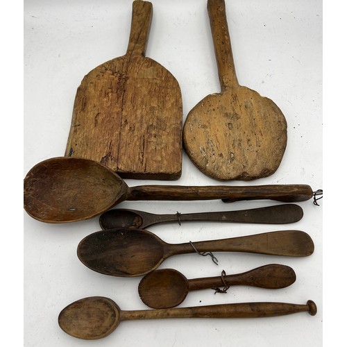 795 - A collection of 18th and 19thC spoons and paddles.