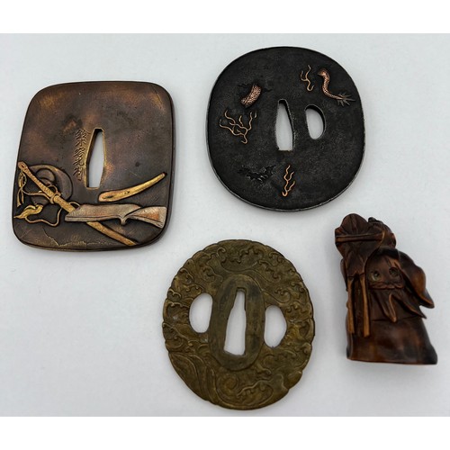 927 - Three Japanese Tsuba 8 x 7.5cm approximately, together with a wooden netsuke.