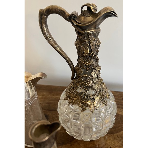 685 - Good quality claret jug with silver plated top 29cm h together with glass jug with plated top, a sil... 