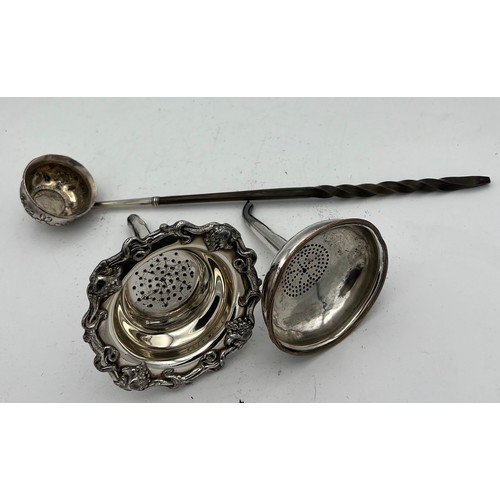 686 - Two 19thC silver plated wine funnels with strainers together with a white metal and baleen toddy lad... 