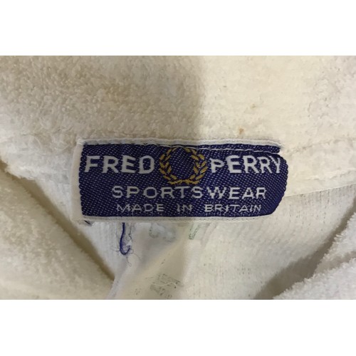 868 - A selection of clothing to include five original Fred Perry items of clothing, two polyester/cotton ... 