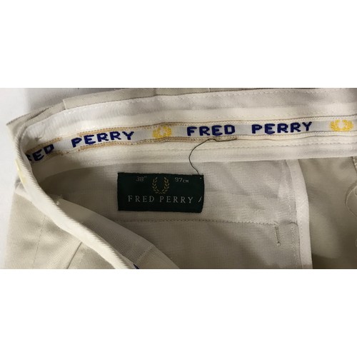 868 - A selection of clothing to include five original Fred Perry items of clothing, two polyester/cotton ... 