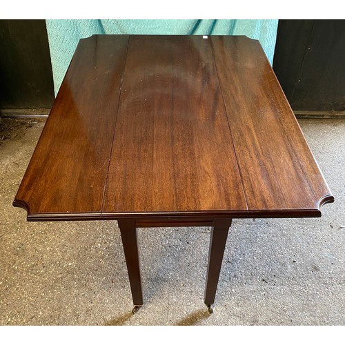 91 - A mahogany drop leaf table with drawer and castors. 74 h x 121 w x 92cm, closed 45cm w.