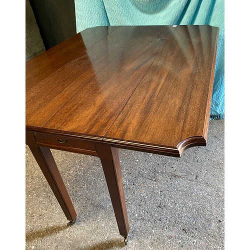 91 - A mahogany drop leaf table with drawer and castors. 74 h x 121 w x 92cm, closed 45cm w.