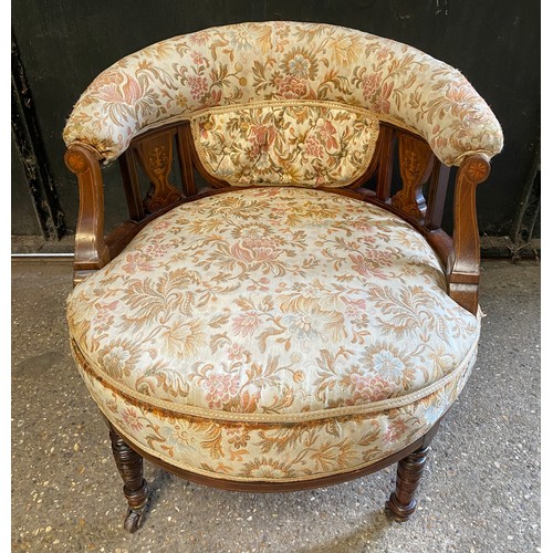 94 - An Edwardian inlaid tub chair on castors. To back 64cm, to seat 38cm, 60cm w.