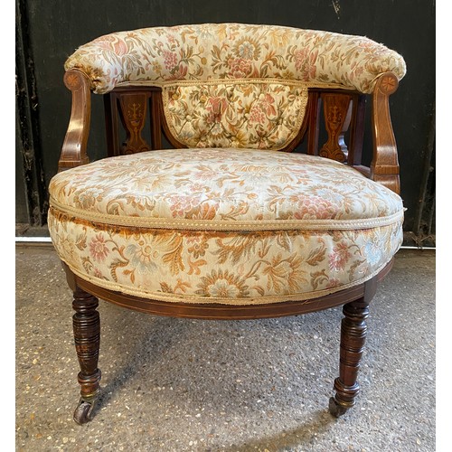 94 - An Edwardian inlaid tub chair on castors. To back 64cm, to seat 38cm, 60cm w.