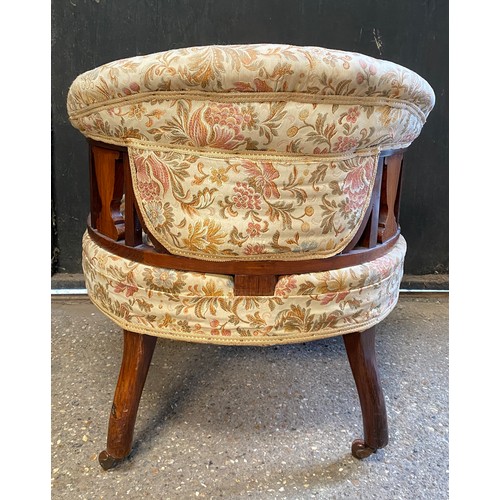 94 - An Edwardian inlaid tub chair on castors. To back 64cm, to seat 38cm, 60cm w.