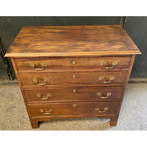 95 - Mahogany chest of 4 long graduating drawers with bone escutcheons. 82.5 h x 85 w x 44.5cm d.