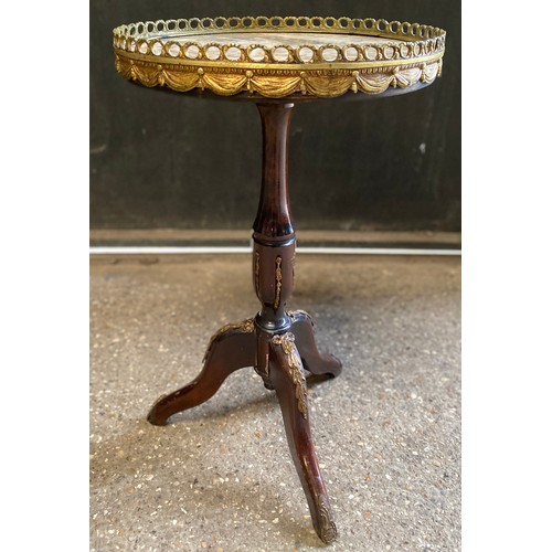 96 - A mahogany continental style tripod occasional table with round marble and gilt metal galleried top.... 