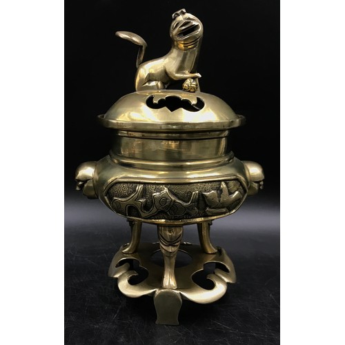 921 - Oriental items to include a Chinese brass incense burner on three feet and stand, A Tibetan teapot w... 