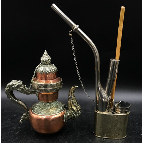 921 - Oriental items to include a Chinese brass incense burner on three feet and stand, A Tibetan teapot w... 