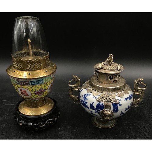 924 - A collection of oriental items to include four vases tallest 25cm h, a blue and white incense burner... 