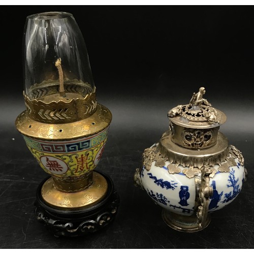 924 - A collection of oriental items to include four vases tallest 25cm h, a blue and white incense burner... 