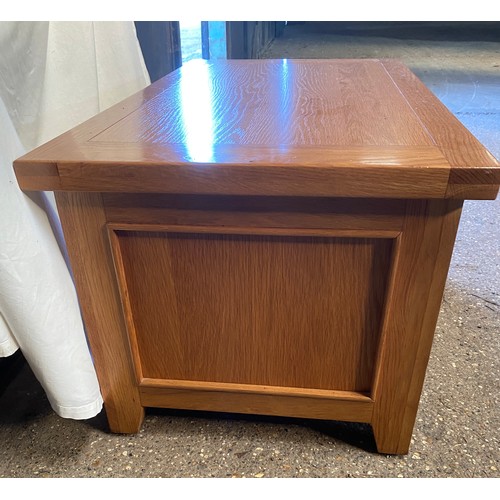 80 - An oak coffee table with four double ended drawers. 51 h x 110 w x 60cm d.