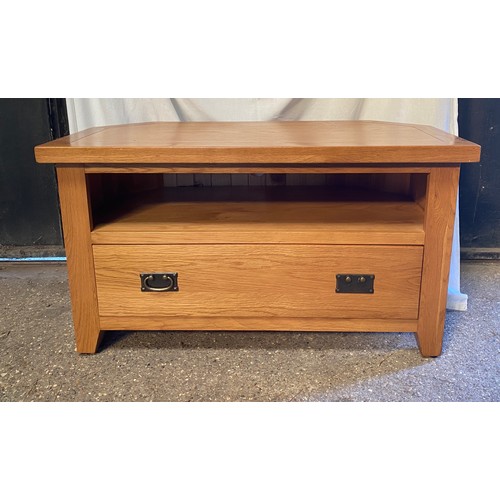 82 - Oak TV stand with shelf and one long drawer. 57 h x102 w x 51cm d.