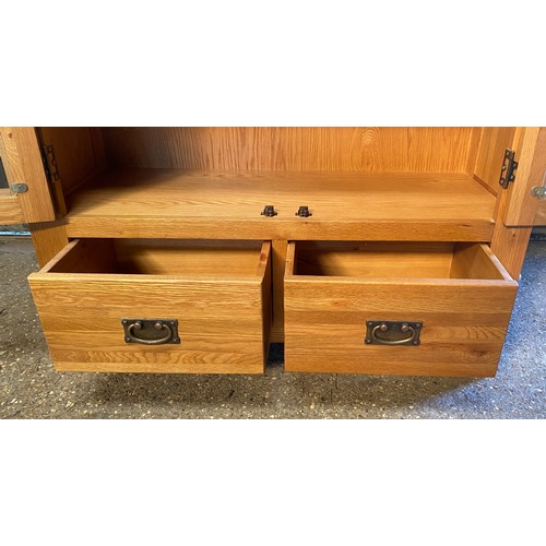 83 - An oak glazed display cabinet/ bookcase with 3 shelves over 2 drawers. 181 h x 100 w x 40cm d.