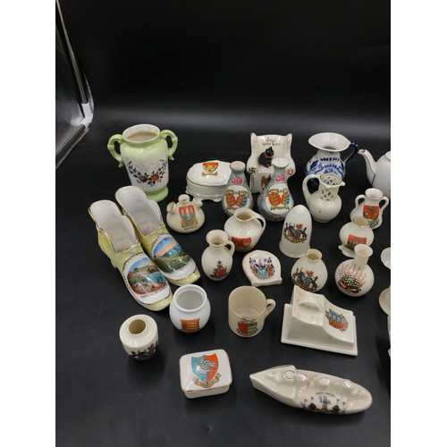 109 - Crested ware to include Arcadian model of a tank and torpedo boat destroyer:Southampton, Lighthouse:... 