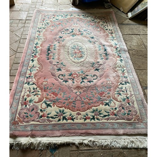 956 - An Indian Imperial Jewel pink ground rug 255 x 155cm.