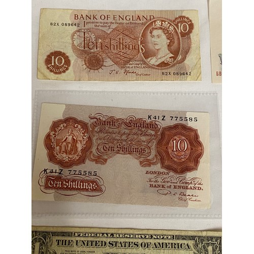 557 - Two ten shilling notes, a one pound note, two U.S. one dollar bills, a 1951 Bulgarian 50 Leva note, ... 