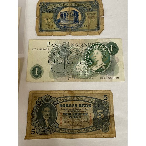 557 - Two ten shilling notes, a one pound note, two U.S. one dollar bills, a 1951 Bulgarian 50 Leva note, ... 