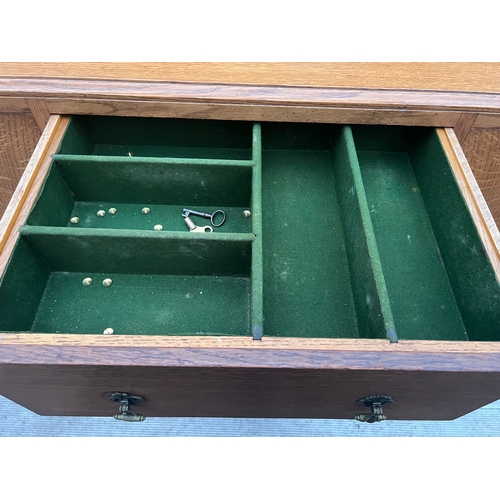 63 - An Art Deco Golden Oak sideboard, table and chairs by TT Cass & Sons, Hull. Sideboard 153 w x 52 d x... 