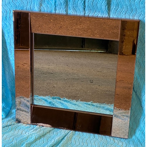 950 - A vintage mirror with rose gold glass  panels and ship design. 83 h x 56cm h l together with a squar... 