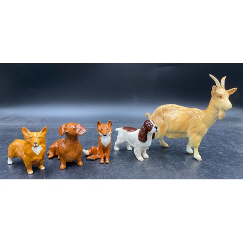 133 - A collection of Beswick animals to include two foxes (one sitting), three dogs spaniel, dachshund, c... 