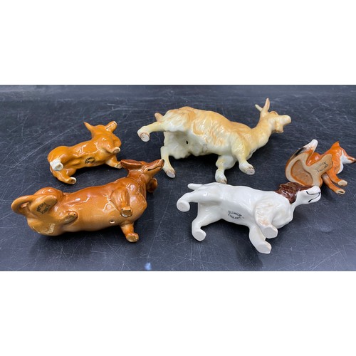 133 - A collection of Beswick animals to include two foxes (one sitting), three dogs spaniel, dachshund, c... 