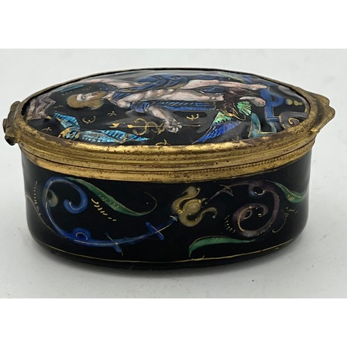 986 - Continental enamel and gilt metal patch box. 6 x 3.5cm.