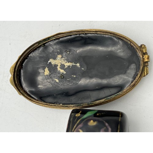 986 - Continental enamel and gilt metal patch box. 6 x 3.5cm.