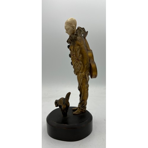 990 - A Georges Omerth French bronze and ivory figure, Pierrot with cat 23cm h. Signed to back. Ivory subm... 