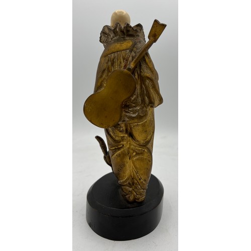 990 - A Georges Omerth French bronze and ivory figure, Pierrot with cat 23cm h. Signed to back. Ivory subm... 