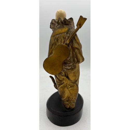 990 - A Georges Omerth French bronze and ivory figure, Pierrot with cat 23cm h. Signed to back. Ivory subm... 