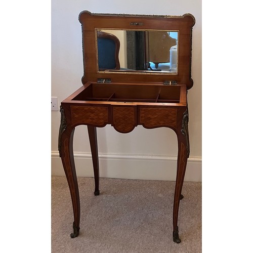 70 - A 19thC parquetry ladies dressing table with ormolu mounts made by and stamped Lamb of Manchester. 6... 