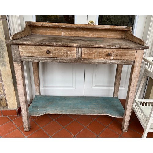 74 - Two drawer beech washstand with upstand and lower shelf.  105cm w x 48cm d x 99cm h.