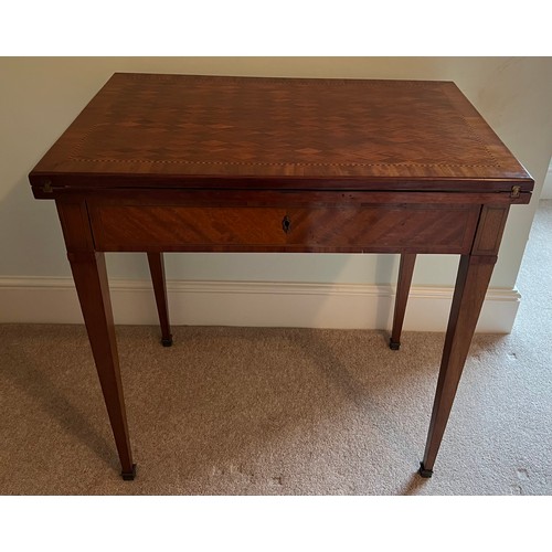 77 - A 19thC French metamorphic writing/card table in mahogany with parquetry top. 74cm w x 48cm d x 77cm... 