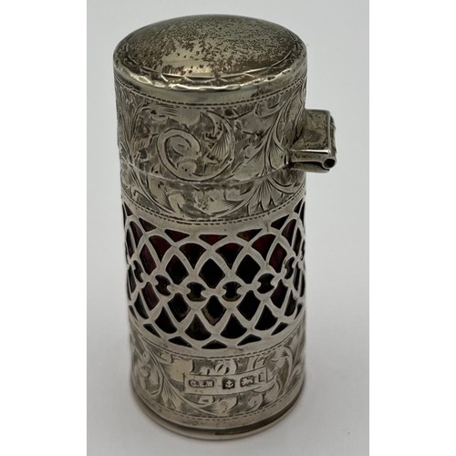 749 - Silver and ruby glass scent bottle with original glass stopper with fretting and engraved decoration... 