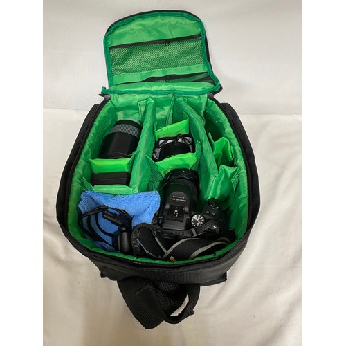 885 - A camera bag and accessories to include a Fujifilm Finepix HS 30 EXR camera, Sigma DG 70-300mm lens,... 