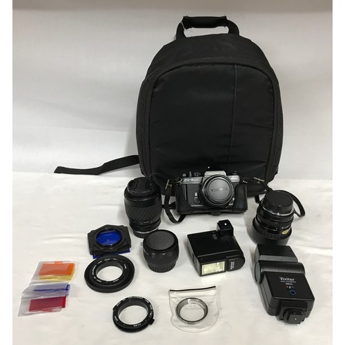 886 - A camera bag and accessories to include a Yashica fx-8 super camera with Yashica 50mm lens attached ... 